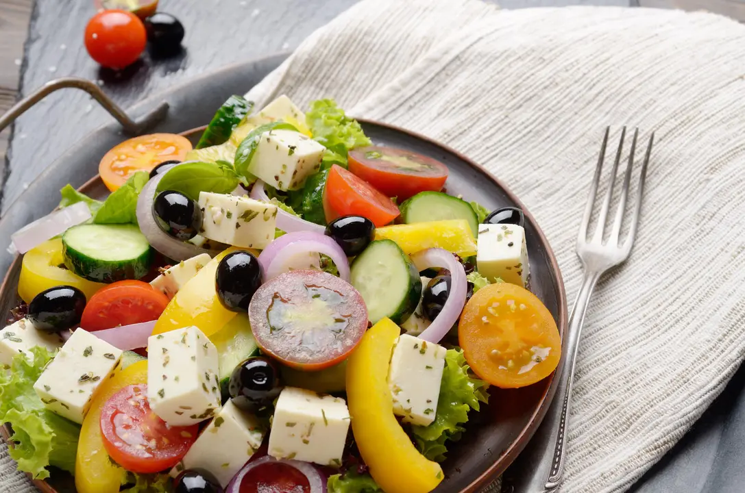 Mediterranean diet dish greek salad on vintage metal tray closeup photo