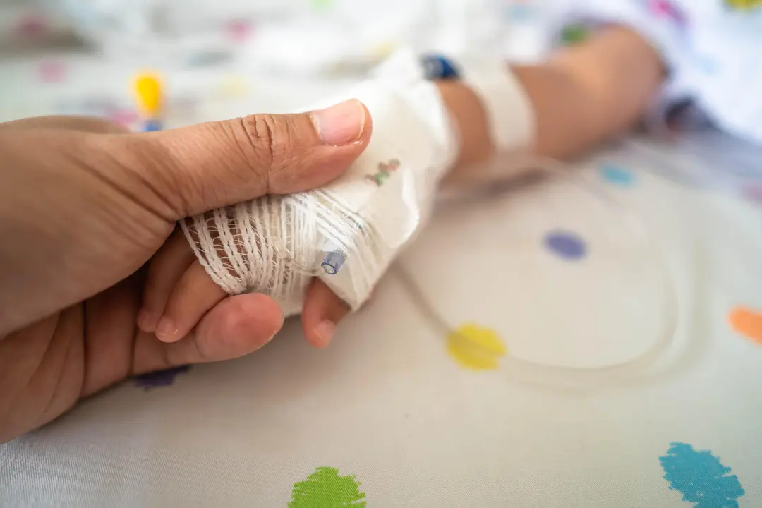 doctor-holds-a-child-hand-in-a-hospital-2026-03-18-06-39-34-utc
