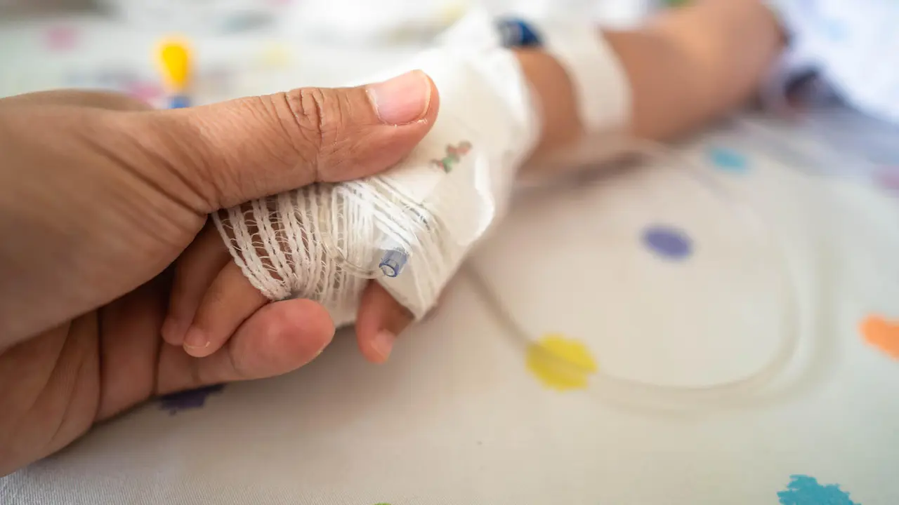 doctor-holds-a-child-hand-in-a-hospital-2026-03-18-06-39-34-utc